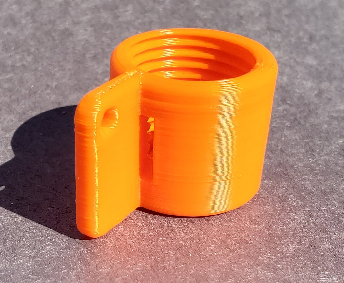 PlugKeyper (Orange) - boat drain plug reminder. Designed for a 1/2 garboard drain plug.