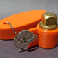 PlugKeyper (Orange) - boat drain plug reminder. Designed for a 1/2 garboard drain plug.