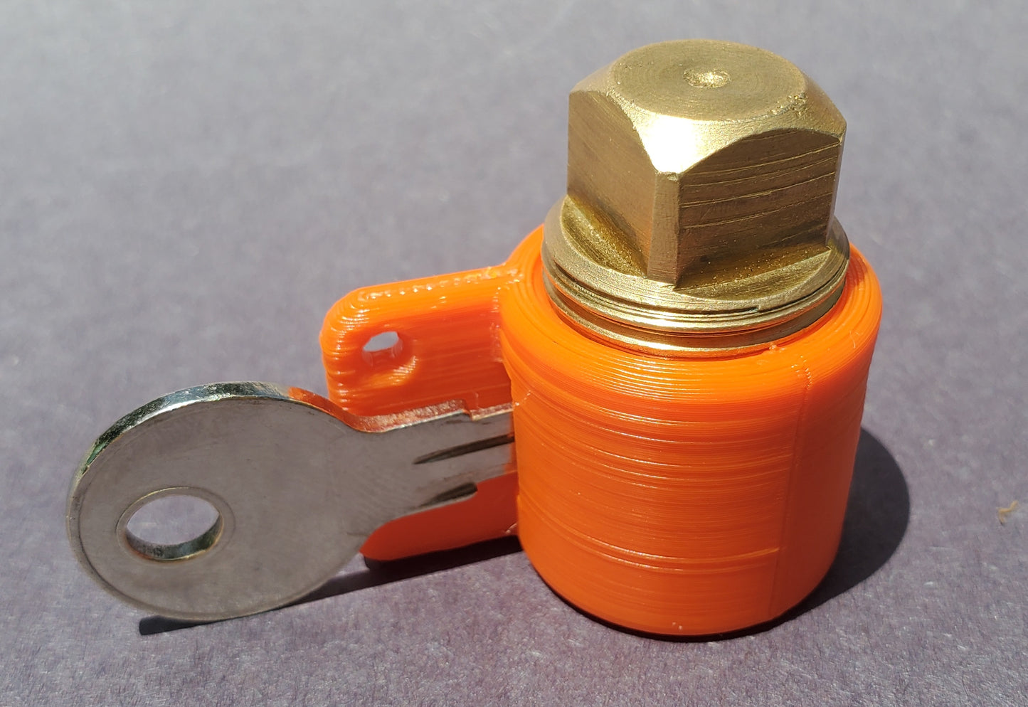 PlugKeyper (Orange) - boat drain plug reminder. Designed for a 1/2 garboard drain plug.